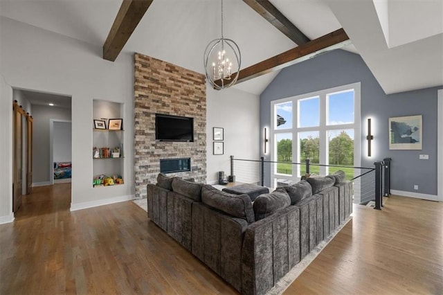 10523 N Dalton Ave, Kansas City, MO 64154 - living area featuring a chandelier, high vaulted ceiling, beamed ceiling, wood finished floors, and baseboards