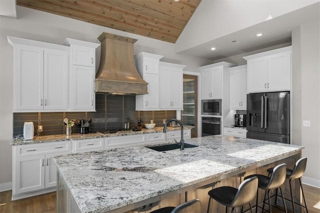 10523 N Dalton Ave, Kansas City, MO 64154 - kitchen with black fridge with ice dispenser, custom range hood, a sink, wall oven, and dark wood-type flooring