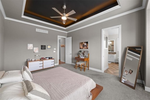 10523 N Dalton Ave, Kansas City, MO 64154 - carpeted bedroom with a raised ceiling, crown molding, baseboards, connected bathroom, and an office area