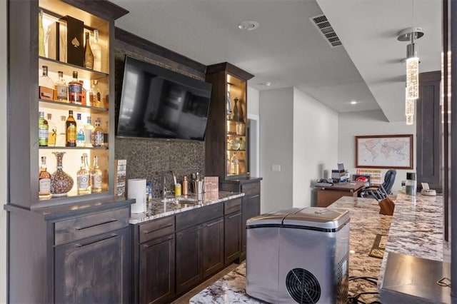 10523 N Dalton Ave, Kansas City, MO 64154 - indoor wet bar with tasteful backsplash, recessed lighting, and hanging light fixtures