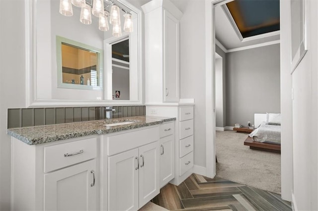 10523 N Dalton Ave, Kansas City, MO 64154 - bathroom featuring vanity, baseboards, and ornamental molding
