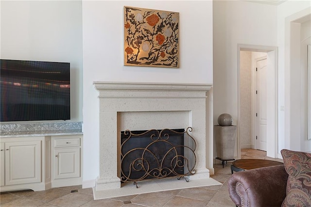 15201 Catalina St, Leawood, KS 66224 - living room featuring a fireplace and light tile patterned floors