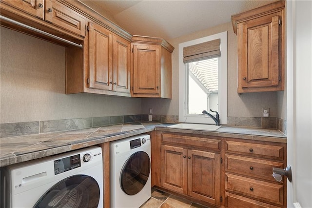 15201 Catalina St, Leawood, KS 66224 - laundry area with washer and clothes dryer and cabinet space