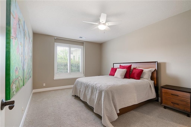 15201 Catalina St, Leawood, KS 66224 - bedroom with light carpet, baseboards, and a ceiling fan
