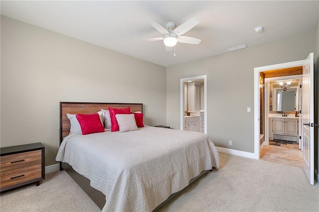 15201 Catalina St, Leawood, KS 66224 - bedroom featuring light colored carpet, ensuite bathroom, baseboards, and ceiling fan