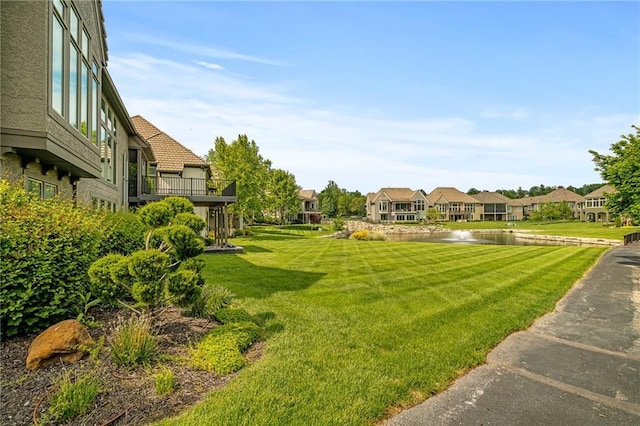 15201 Catalina St, Leawood, KS 66224 - view of green lawn featuring a water view and a residential view