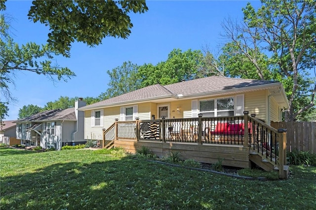 201 N Cleveland Ave, Belton, MO 64012 - rear view of house with a yard and a deck