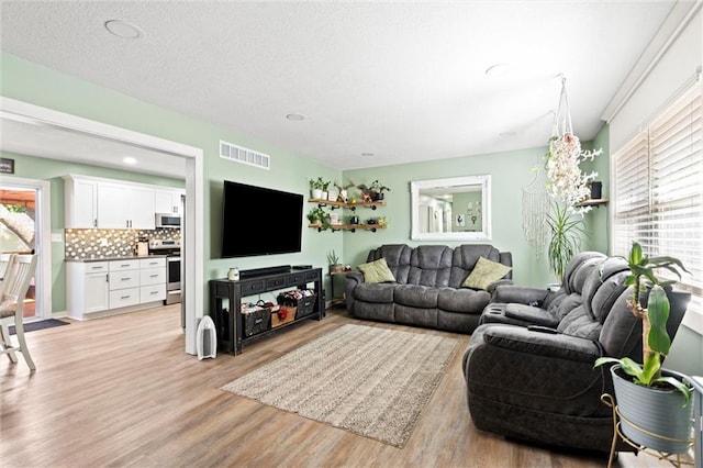 201 N Cleveland Ave, Belton, MO 64012 - living room with light wood finished floors