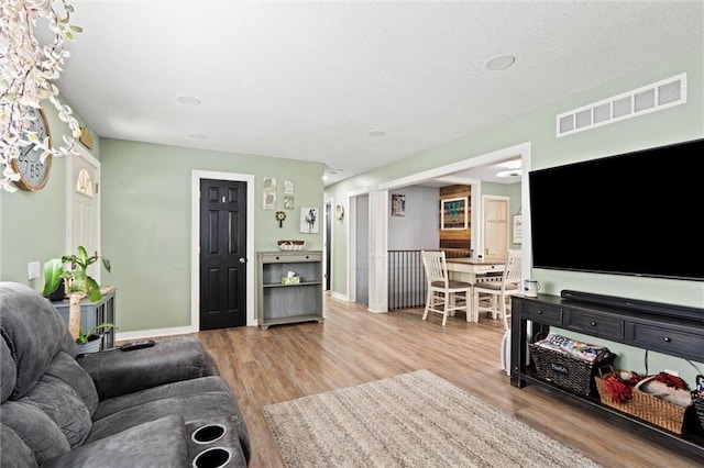 201 N Cleveland Ave, Belton, MO 64012 - living room featuring wood finished floors and baseboards