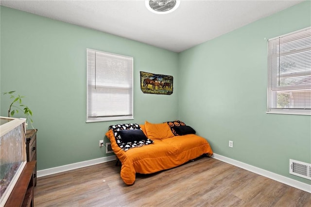 201 N Cleveland Ave, Belton, MO 64012 - sitting room with wood finished floors and baseboards