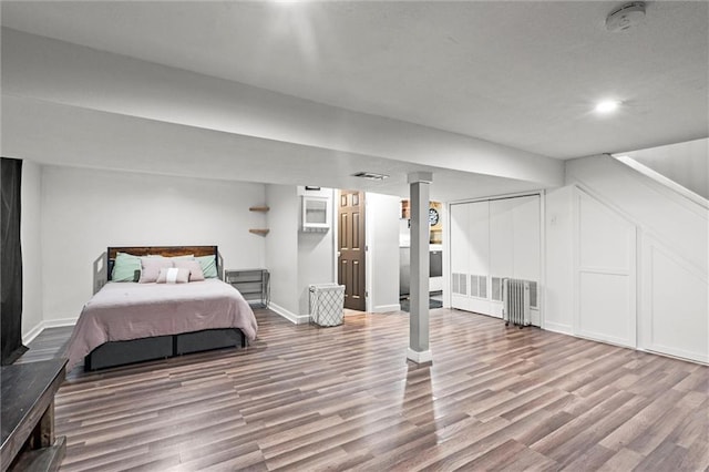 201 N Cleveland Ave, Belton, MO 64012 - bedroom featuring wood finished floors and baseboards