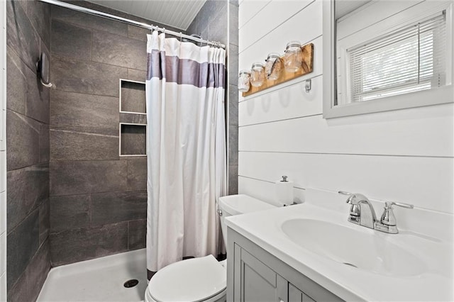 201 N Cleveland Ave, Belton, MO 64012 - full bathroom featuring toilet, a tile shower, and vanity