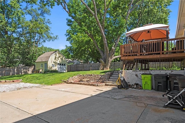 201 N Cleveland Ave, Belton, MO 64012 - view of patio / terrace featuring stairway, an outbuilding, a deck, and a detached garage