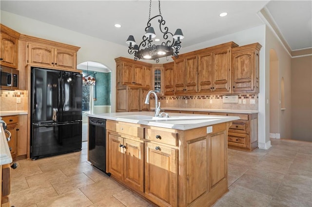 4704 W 152nd St, Leawood, KS 66224 - kitchen with black appliances, a chandelier, tasteful backsplash, light countertops, and recessed lighting