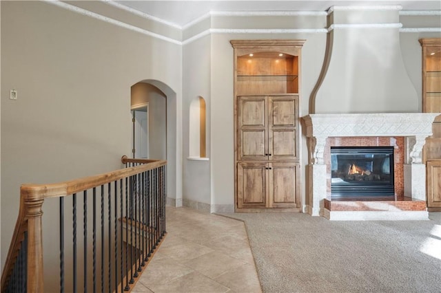 4704 W 152nd St, Leawood, KS 66224 - hallway with crown molding, an upstairs landing, and light tile patterned floors