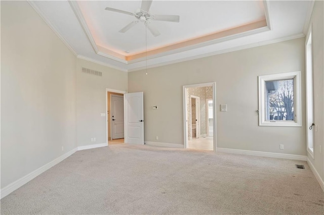 4704 W 152nd St, Leawood, KS 66224 - unfurnished bedroom featuring a tray ceiling, light carpet, ornamental molding, and a ceiling fan