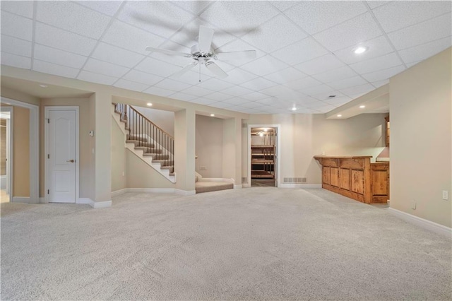 4704 W 152nd St, Leawood, KS 66224 - finished basement featuring stairs, carpet floors, a dry bar, a drop ceiling, and ceiling fan