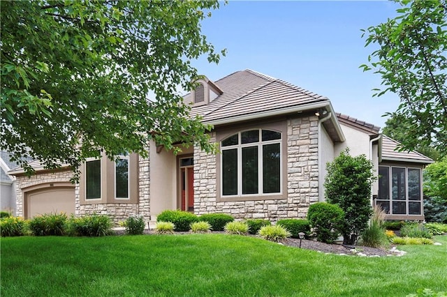 4704 W 152nd St, Leawood, KS 66224 - view of front of house with stone siding, an attached garage, a front yard, a sunroom, and stucco siding