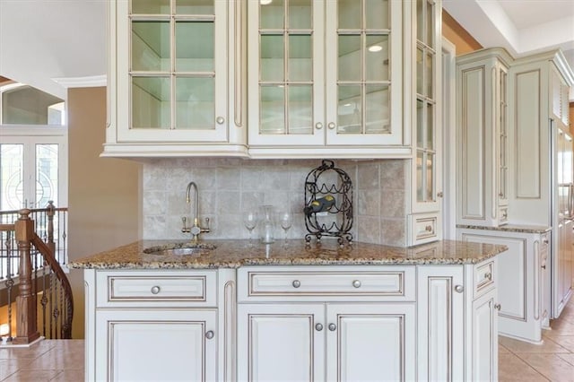 21211 E 34th St S, Independence, MO 64057 - indoor wet bar featuring light tile patterned floors and backsplash