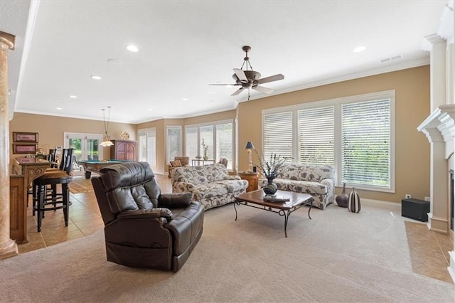 21211 E 34th St S, Independence, MO 64057 - living room with ornamental molding, ornate columns, healthy amount of natural light, a fireplace, and recessed lighting
