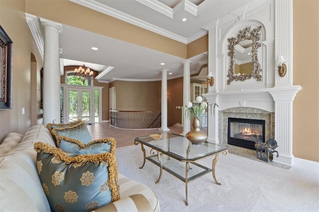 21211 E 34th St S, Independence, MO 64057 - living room featuring a premium fireplace, crown molding, decorative columns, vaulted ceiling, and a chandelier