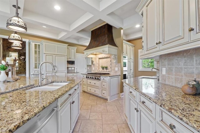 21211 E 34th St S, Independence, MO 64057 - kitchen with premium range hood, appliances with stainless steel finishes, backsplash, beamed ceiling, and hanging light fixtures