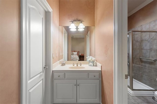 21211 E 34th St S, Independence, MO 64057 - ensuite bathroom with a stall shower, vanity, and ornamental molding