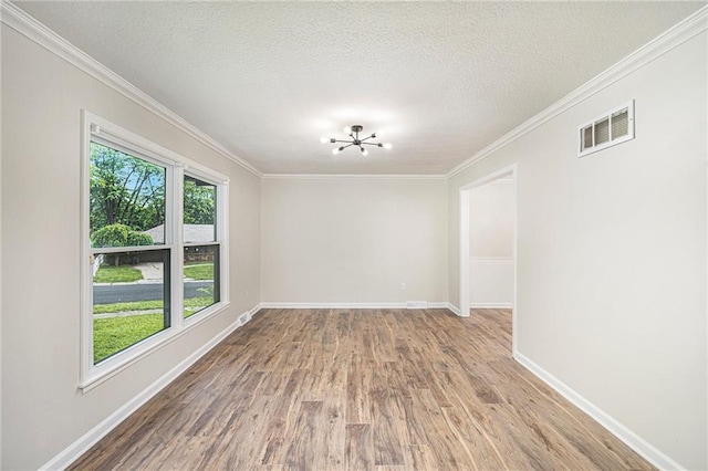 1917 N Concord Rd, Independence, MO 64058 - spare room with a chandelier, wood finished floors, crown molding, and a textured ceiling