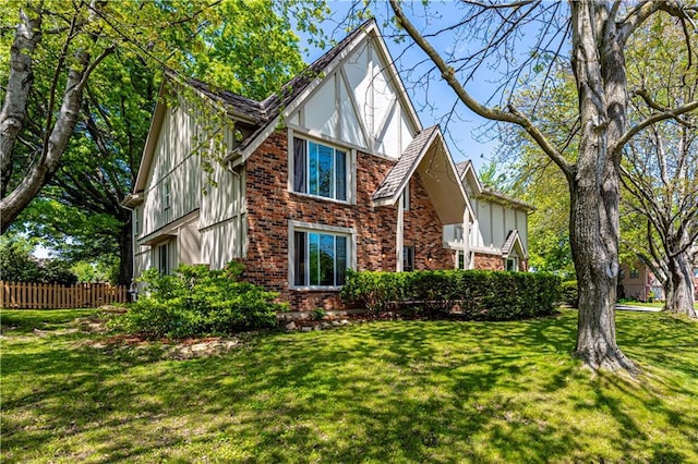 view of front of home featuring brick siding and board and batten siding
