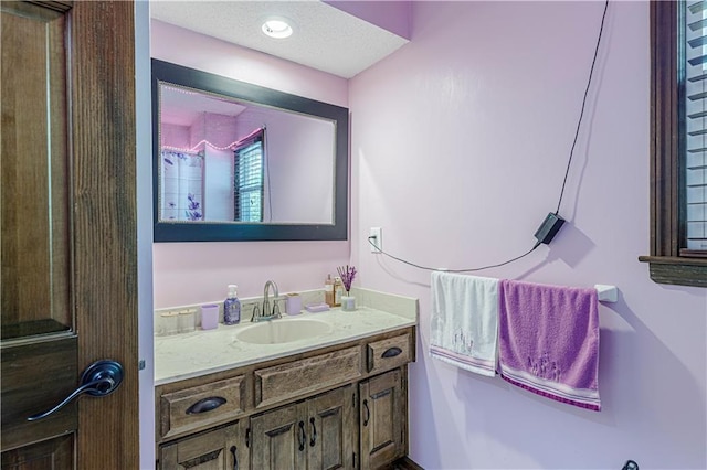 bathroom featuring vanity and a textured ceiling