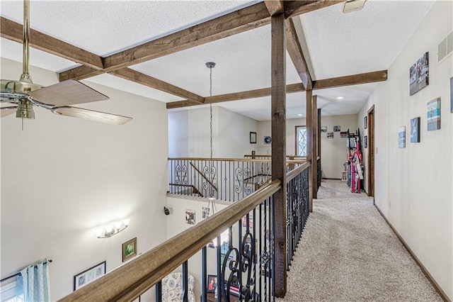 hall with beam ceiling, carpet, baseboards, a textured ceiling, and recessed lighting