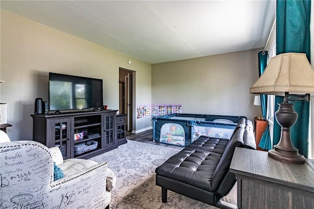 1007 Vest Dr, Warrensburg, MO 64093 - living room with wood finished floors and baseboards