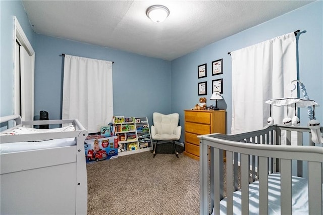 1007 Vest Dr, Warrensburg, MO 64093 - carpeted bedroom with a nursery area and a closet