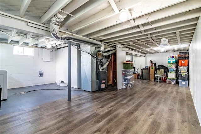 1007 Vest Dr, Warrensburg, MO 64093 - below grade area featuring wood finished floors and heating unit