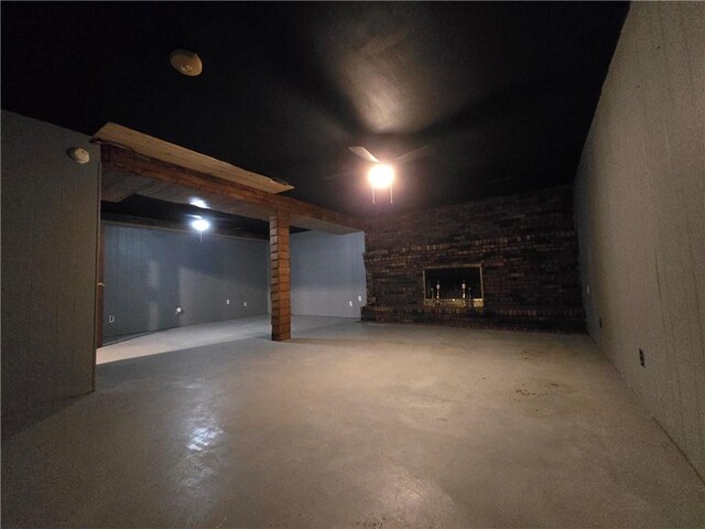 finished below grade area with a brick fireplace