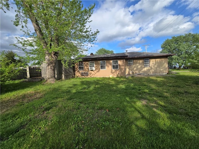 back of house with a chimney