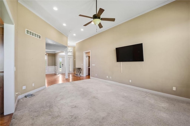 unfurnished living room with carpet floors, ornamental molding, ceiling fan, decorative columns, and recessed lighting