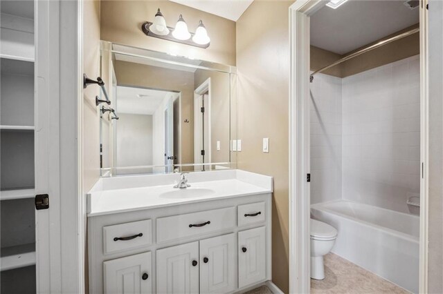 full bath with toilet, vanity, and tub / shower combination