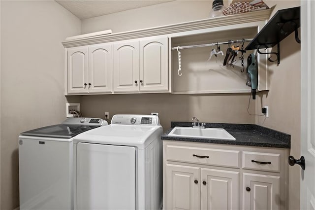 washroom featuring cabinet space and washer and dryer