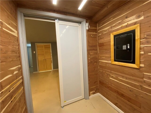 220 N 9th St, Atchison, KS 66002 - corridor featuring wood walls and finished concrete flooring