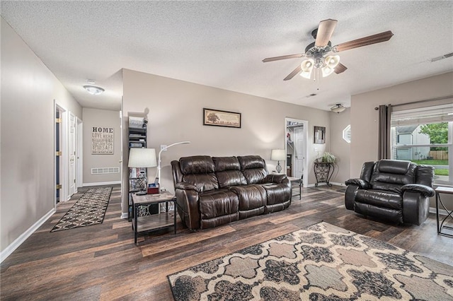 19204 E 15th Terrace Ct N, Independence, MO 64056 - living room with wood finished floors, a textured ceiling, ceiling fan, and baseboards