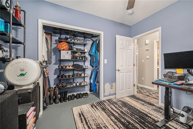 19204 E 15th Terrace Ct N, Independence, MO 64056 - workout room with a ceiling fan and baseboards