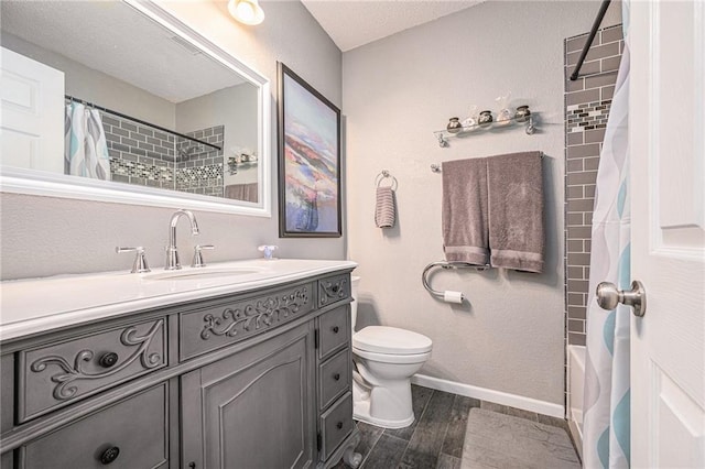 19204 E 15th Terrace Ct N, Independence, MO 64056 - full bathroom with vanity, wood finished floors, toilet, baseboards, and shower / tub combo