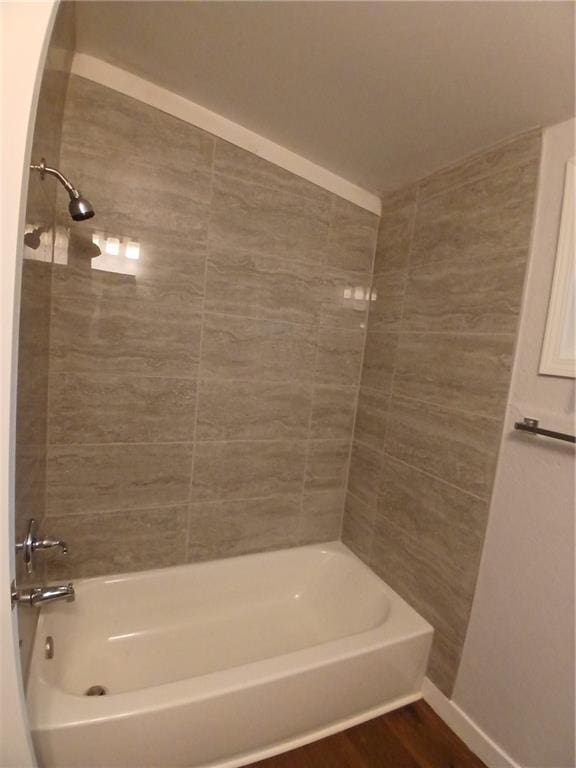 1029 Shearer Rd, Kansas City, KS 66103 - full bathroom featuring bathtub / shower combination, baseboards, and wood finished floors
