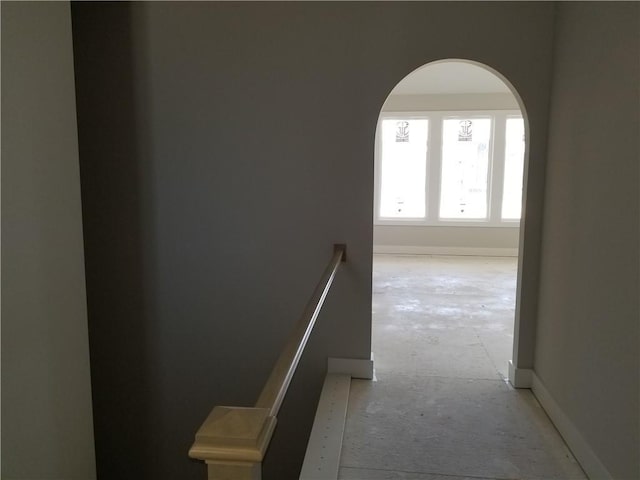 4615 N 144th Ter, Basehor, KS 66007 - hall featuring arched walkways and an upstairs landing