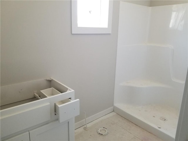4615 N 144th Ter, Basehor, KS 66007 - bathroom featuring a shower and baseboards