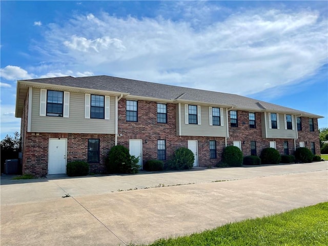596 SE 105th Rd, Warrensburg, MO 64093 - townhome / multi-family property with brick siding and cooling unit