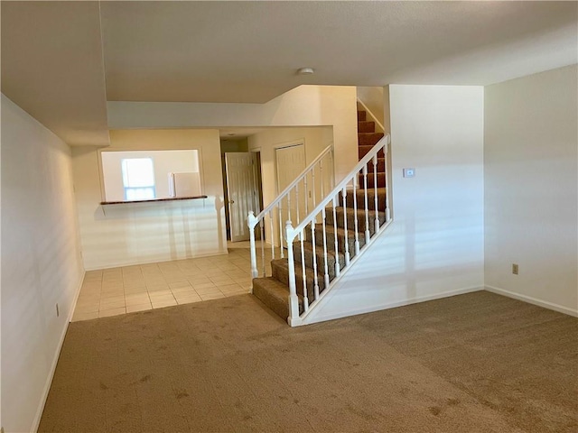596 SE 105th Rd, Warrensburg, MO 64093 - stairway featuring carpet flooring, baseboards, and tile patterned floors