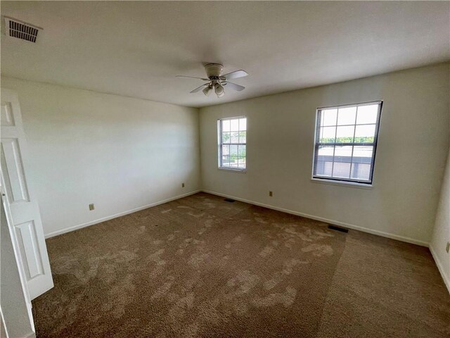 596 SE 105th Rd, Warrensburg, MO 64093 - carpeted empty room featuring ceiling fan and baseboards