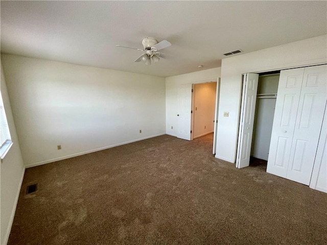 596 SE 105th Rd, Warrensburg, MO 64093 - unfurnished bedroom featuring dark carpet, baseboards, and ceiling fan